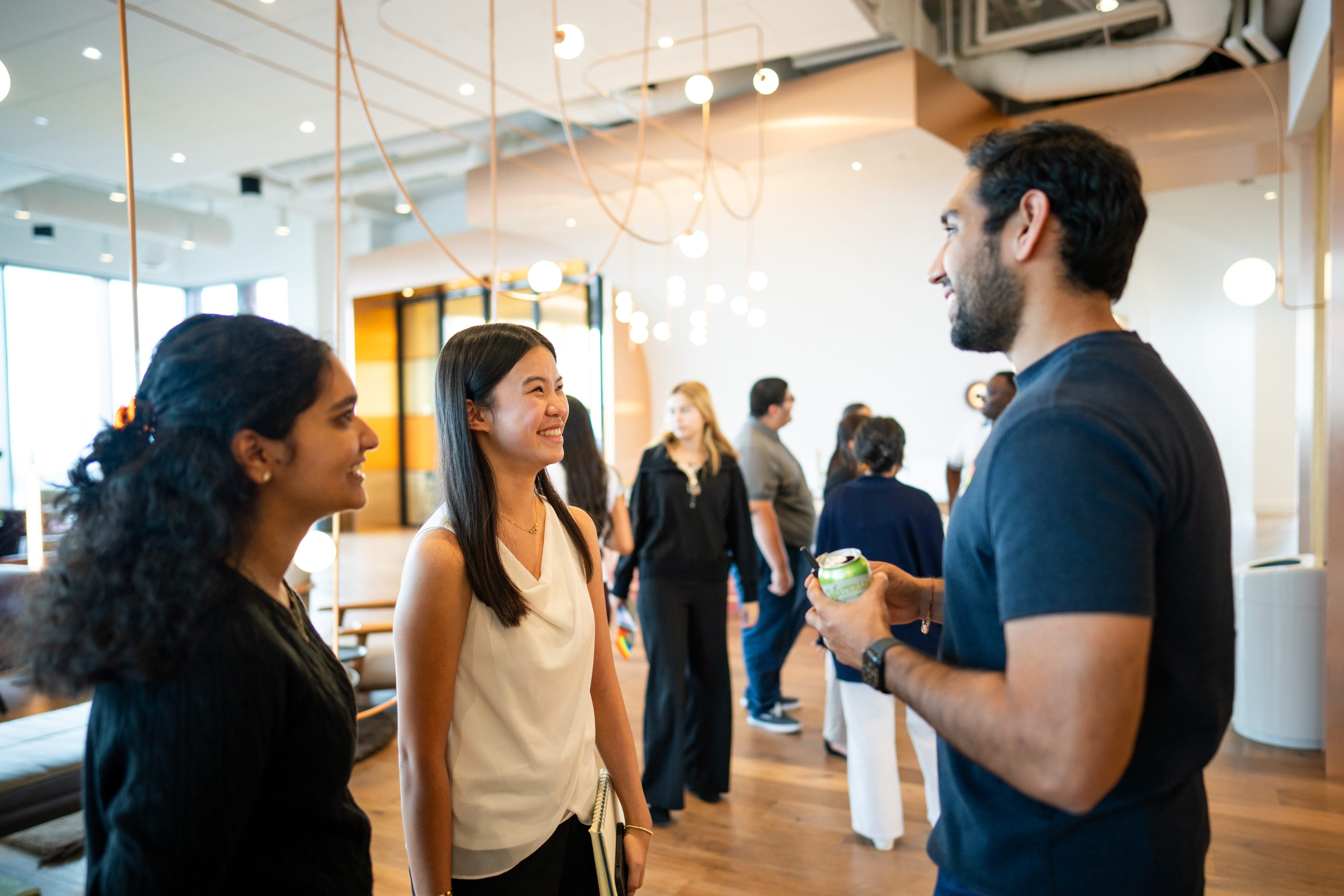 Atlas Scholars mingling with a mentor at a BCG site visit